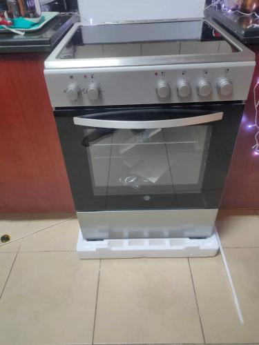 a stove in a kitchen with its door open at Ahlan New Horizon JBR in Dubai
