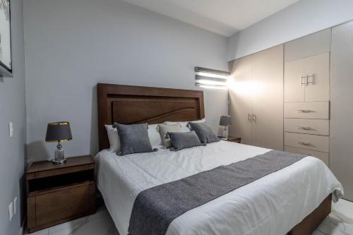 Postel nebo postele na pokoji v ubytování Refugio exclusivo en Zapotlanejo centro Suite 303