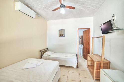 Postel nebo postele na pokoji v ubytování Pousada São Jorge