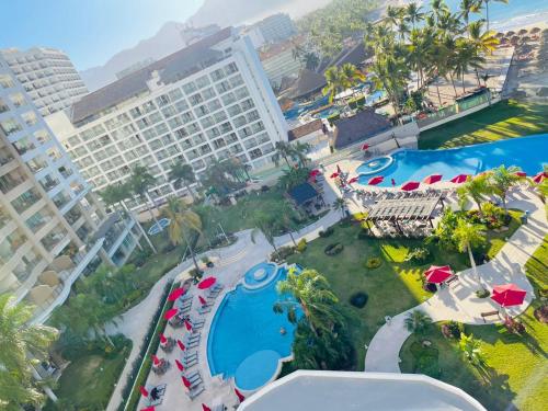 an aerial view of the pool at a resort at Amazing views, beachfront Grand Venetian in Puerto Vallarta