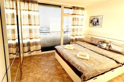 a bedroom with a bed with two towels on it at 2 Zimmer Wohnung für 2 in Mülheim an der Ruhr