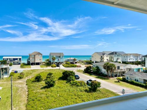 a view of the ocean from the balcony of a apartment at 104 Queen Pet Friendly Suite, 1st Floor Nest in Surf City