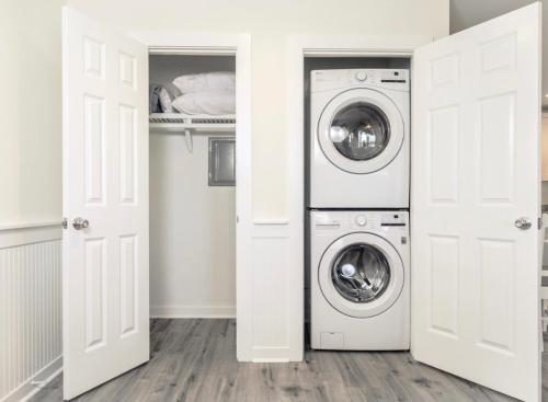 a laundry room with a washer and dryer at 104 Queen Pet Friendly Suite, 1st Floor Nest in Surf City