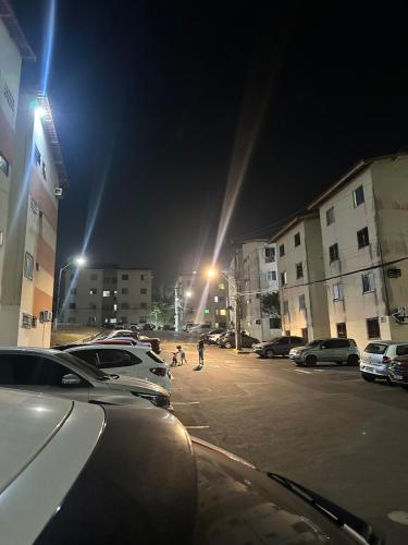 a parking lot at night with cars parked in a parking lot at Ap design 002 Cond Cais da Sagração Angelim in São Luís
