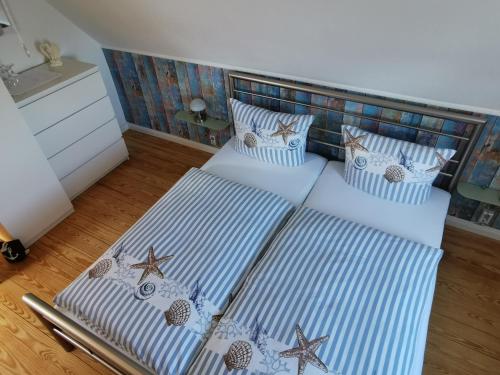 Postel nebo postele na pokoji v ubytování Gästehaus Arkona