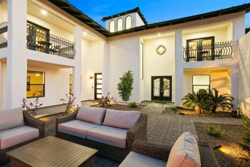 a patio of a house with couches and a table at NEW Gold Dust Private Villa in Scottsdale