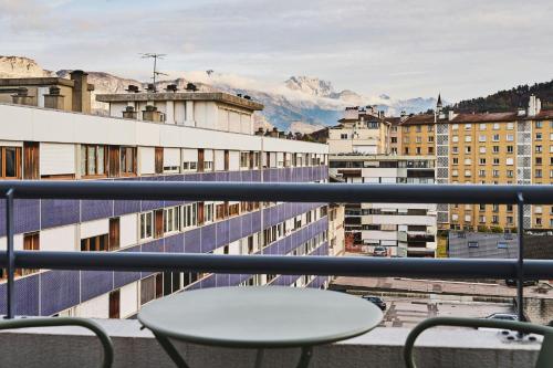 a view from a balcony with a table and chairs at Moxy Annecy in Annecy