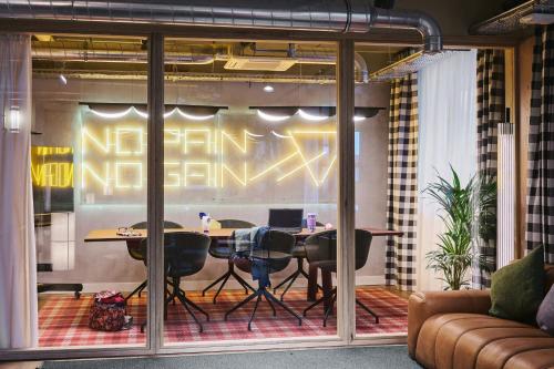 a conference room with a table and chairs in it at Moxy Annecy in Annecy