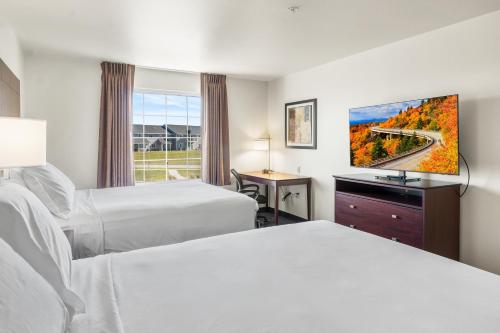 Postel nebo postele na pokoji v ubytování Cobblestone Hotel & Suites - Ephraim