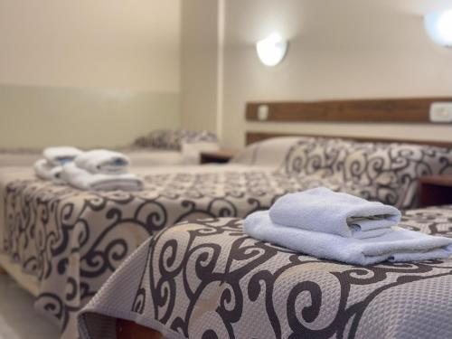 Postel nebo postele na pokoji v ubytování Hotel Dali