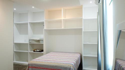 En eller flere senge i et værelse på Casa Maragogi