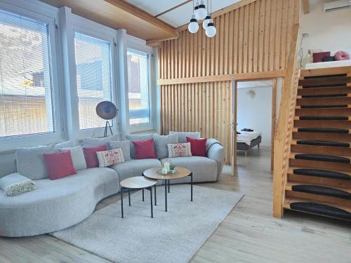 a living room with a couch and a table at ganzes Haus für dich 20min bis nach Interlaken und Adelboden in Frutigen