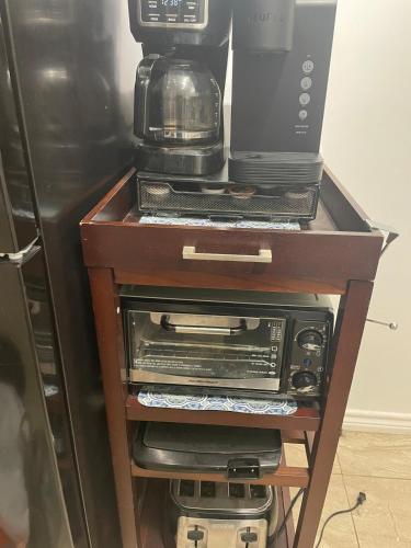 a table with a coffee maker and a blender on it at Ocean Front Condo - 3 Bdrms - Hot Tubs - 2 Pools - Gym - Tennis ct - SS2203 in Galveston