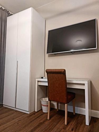 TV a/nebo společenská místnost v ubytování PerlaToscana