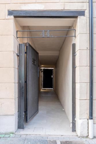 an entrance to a building with an open door at Prime Stay Apartments in Paisley