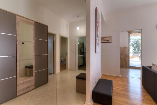a living room with a couch and a large closet at Sea View Apartments MonteBook in Becici