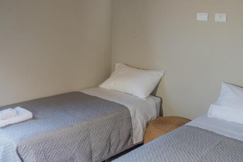 a room with two beds and a pillow at Blend Lodges in Tunuyán