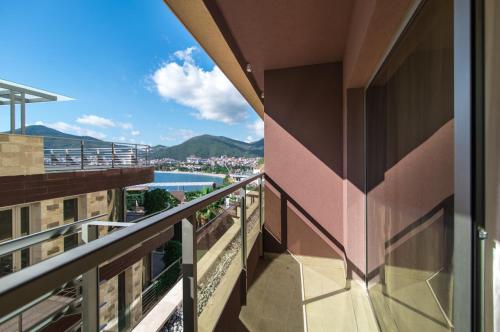a balcony with a view of a city at Sea View Apartments MonteBook in Becici