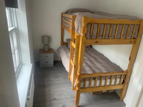 a couple of bunk beds in a room at Priory View in Saint Osyth
