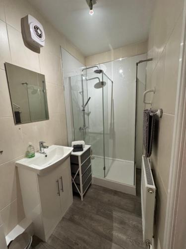 a bathroom with a sink and a shower at Omega Apartment - 3 Bedrooms - Sleeps 5 in Whitehaven