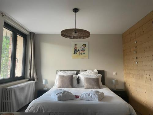 Postel nebo postele na pokoji v ubytování L'Impasse en Duo, appartement cosy 2 personnes avec SPA extérieur privé