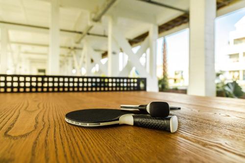 a skateboard laying on top of a wooden table at 3008 King Suite, 3rd Floor Serenity in Surf City