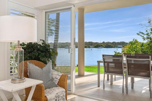a living room with a view of the water at 4-76 Hilton Terrace Noosaville QLD 4566 in Tewantin