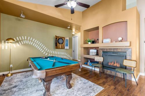a room with a pool table and a fireplace at Cozy 4BR Near Ski Resort - Firepit & Pool Table in Flagstaff
