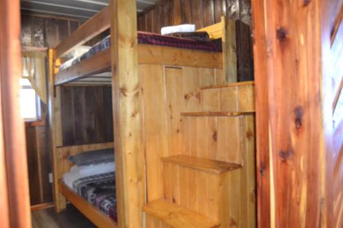a wooden cabin with two bunk beds in it at Restful River Cabin, Red River Gorge, KY, River Access & Views in Stanton