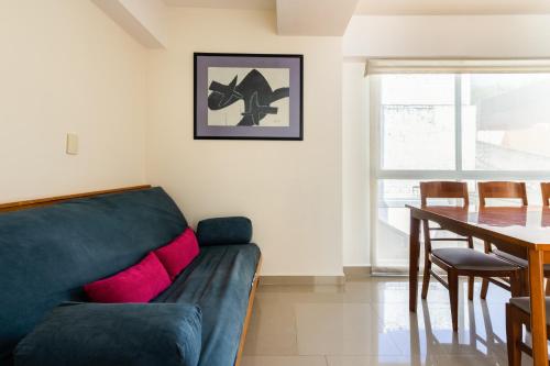 a living room with a couch and a table at C101 - 2BR - 2BTh in Mexico City