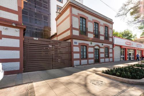 a building with a wooden fence on a street at C101 - 2BR - 2BTh in Mexico City
