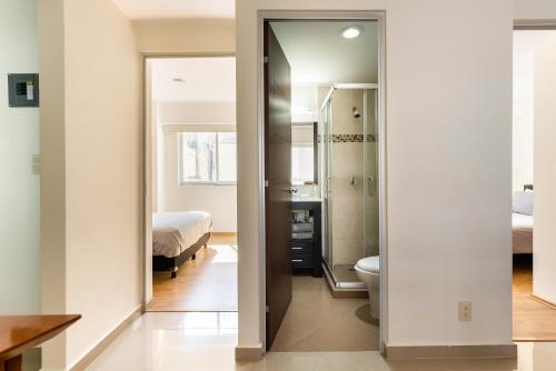 a bathroom with a sink and a toilet in a room at C101 - 2BR - 2BTh in Mexico City