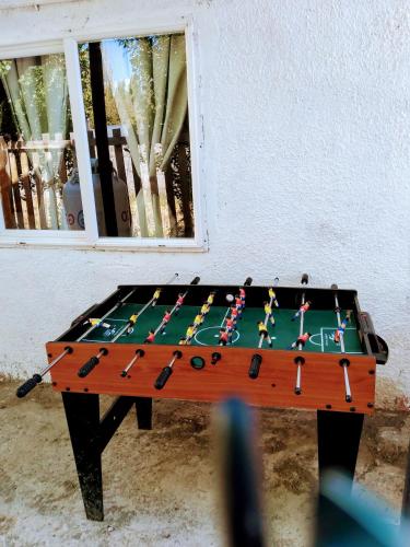 a foosball table in the corner of a room at Calfu in Chile Chico
