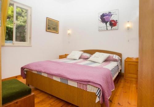 Postel nebo postele na pokoji v ubytování Apartments Damir