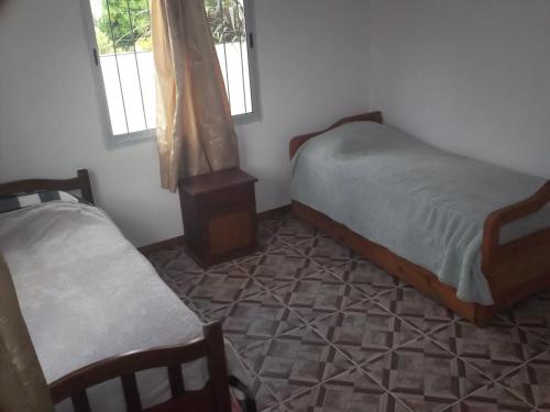 Postel nebo postele na pokoji v ubytování Casa Costa azul