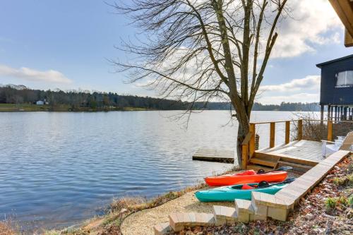 a group of kayaks sitting on the shore of a lake at Victorian Lake Oasis Hot Tub Private Lakefront in Lake Huntington