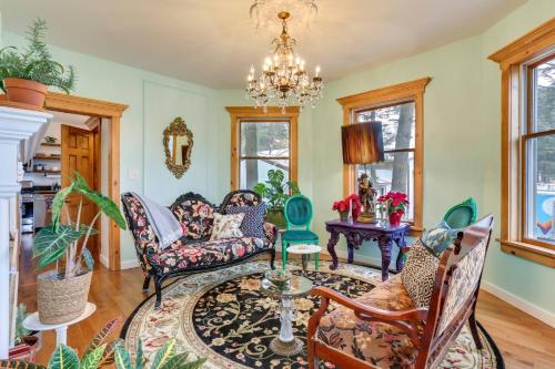 a living room with furniture and a chandelier at Victorian Lake Oasis Hot Tub Private Lakefront in Lake Huntington