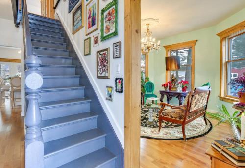 a blue staircase in a home with a chair at Victorian Lake Oasis Hot Tub Private Lakefront in Lake Huntington