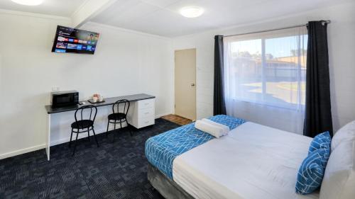 Postel nebo postele na pokoji v ubytování RAMS Motel