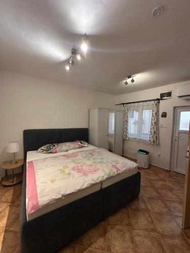 a bedroom with a large bed in a room at Penzion 4 Dvory in České Budějovice