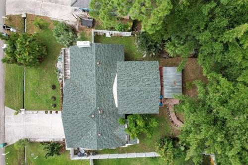 an overhead view of a yard with green roofs at Chic 4BR Home Hot Tub Game Room in Port Saint Lucie