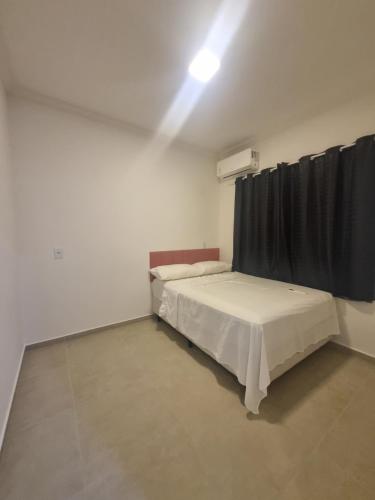 Postel nebo postele na pokoji v ubytování Flat Praia Dourada 5