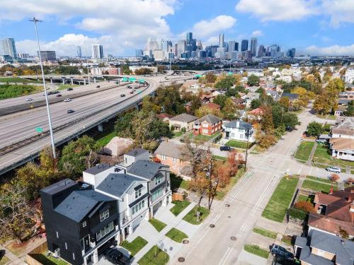 an aerial view of a city with a highway at Houston- Downtown, NRG, Med Center, City Views, U of H & TSU in Houston