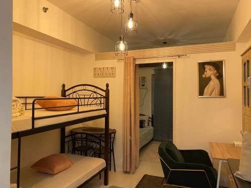 a room with a bunk bed and a dining room at Moldex residences Silang in Biluso