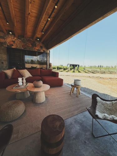 a living room with a couch and a table at Finca Boutique Un Buen Año in Tres Esquinas