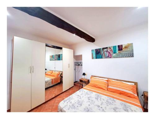 a bedroom with a bed and two beds at La casa del Borgo Anagni in Anagni