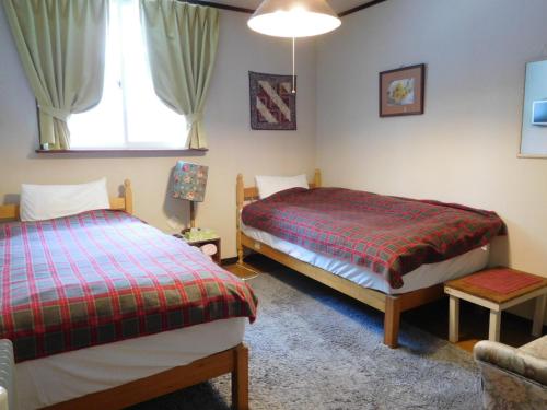 Postel nebo postele na pokoji v ubytování Country Lodge Farmstay