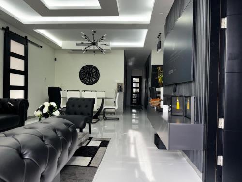 a living room with couches and a dining room at Tranquility Love Bay in Richmond