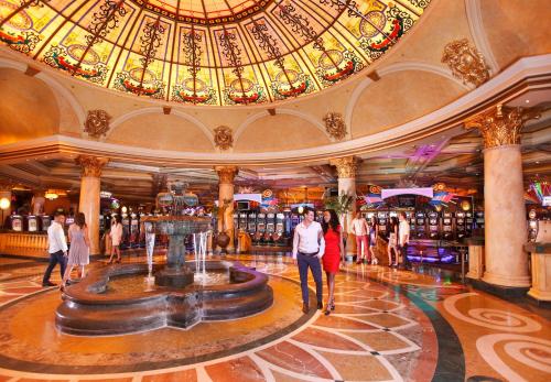 a lobby with a fountain in the middle of a mall at Peermont D'oreale Grande at Emperors Palace in Kempton Park
