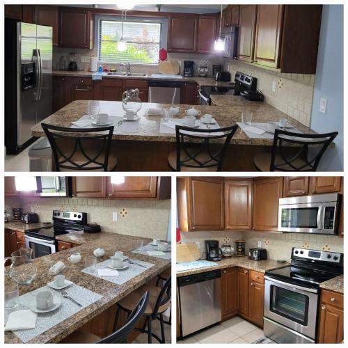 a kitchen with wooden cabinets and a counter with chairs at Cape Coral, Pool Home, On Fresh Water Canal, Fishing, Free Wi-fi & Game Room in Cape Coral